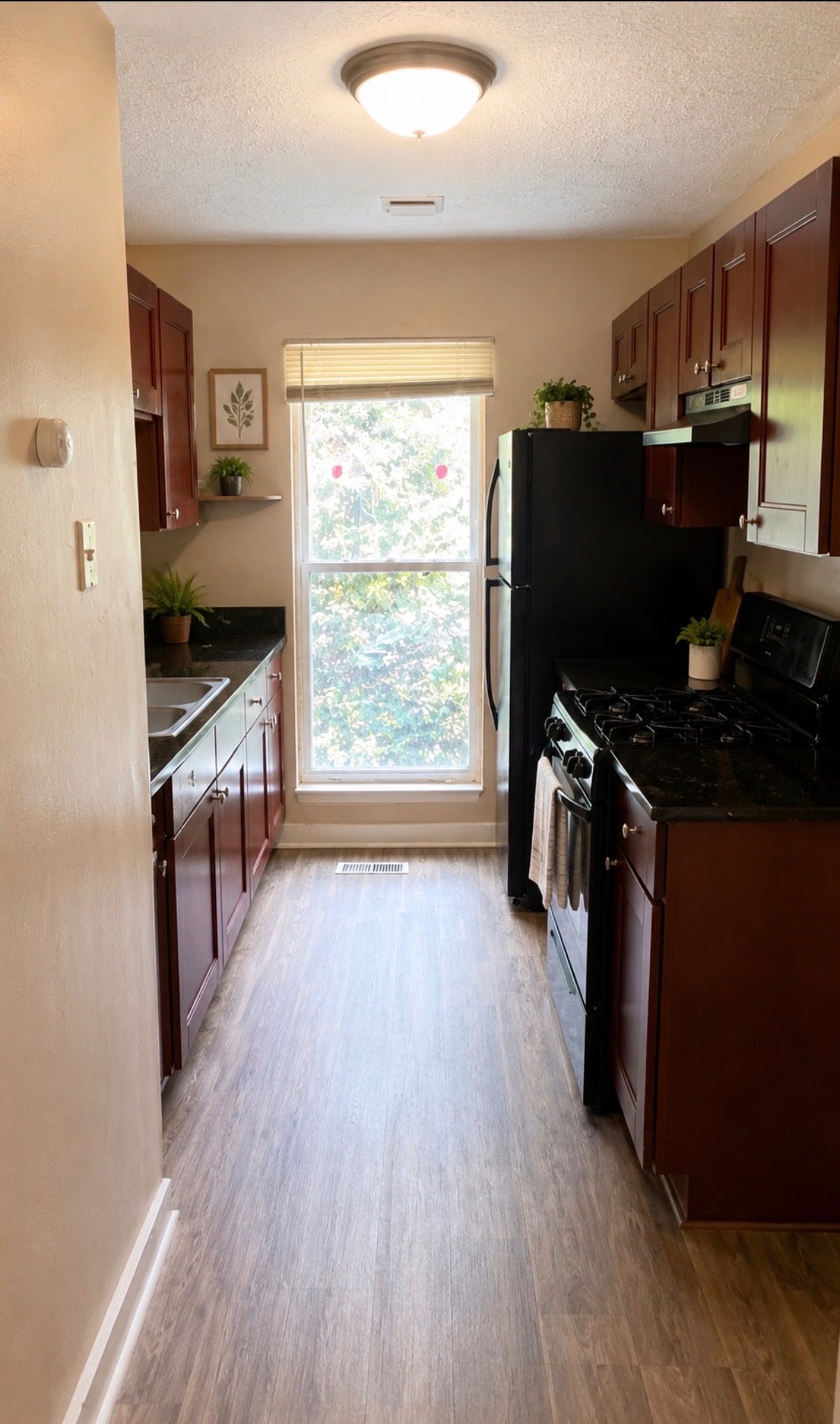 Galley kitchen with granite countertops
